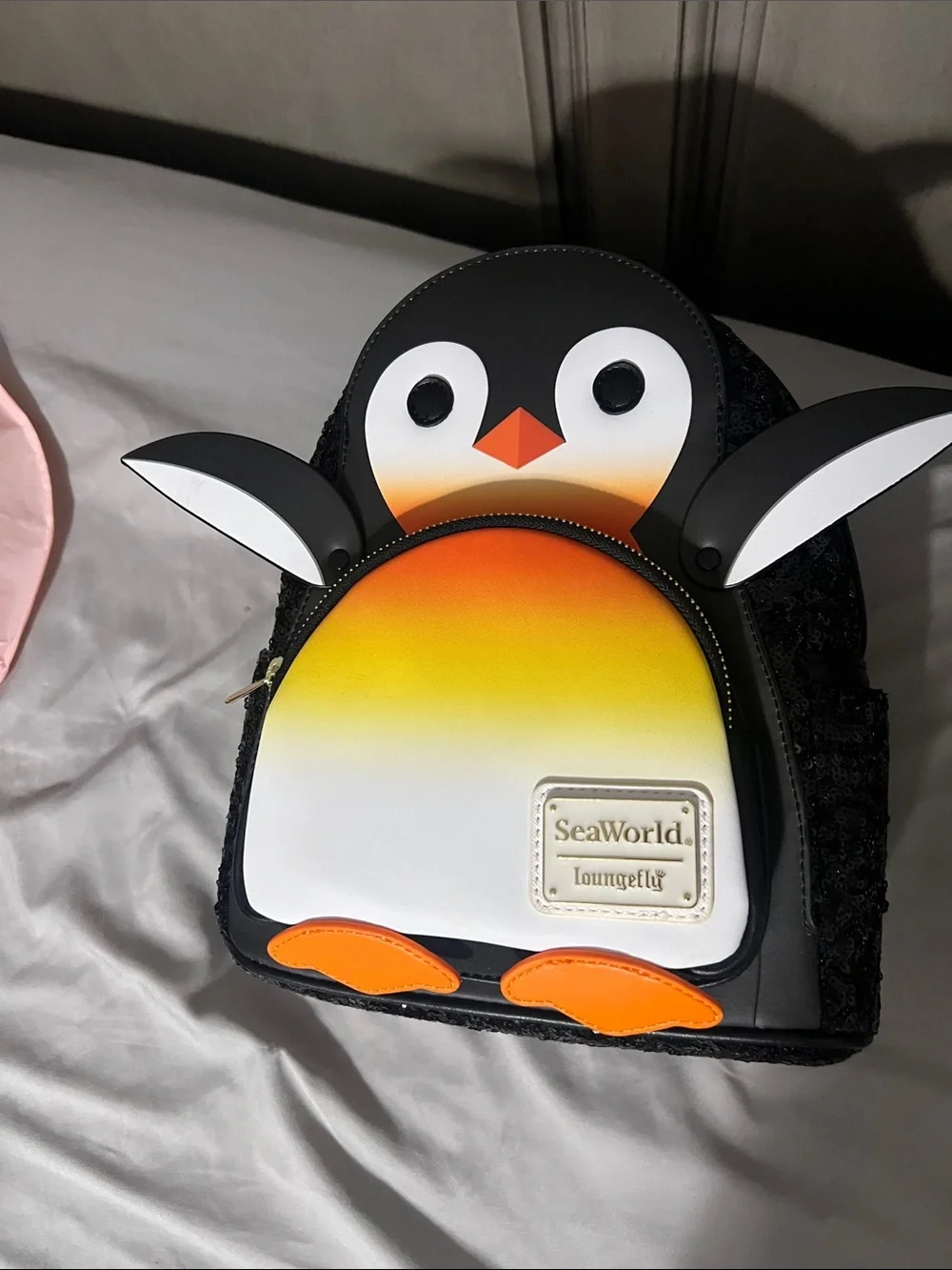 Loungefly SeaWorld Penguin Kids Mini Backpack in Black, Orange & Yellow